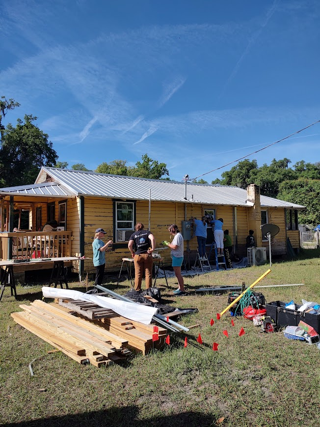 Working with Rebuilding Together on restoring a community member's historic home.