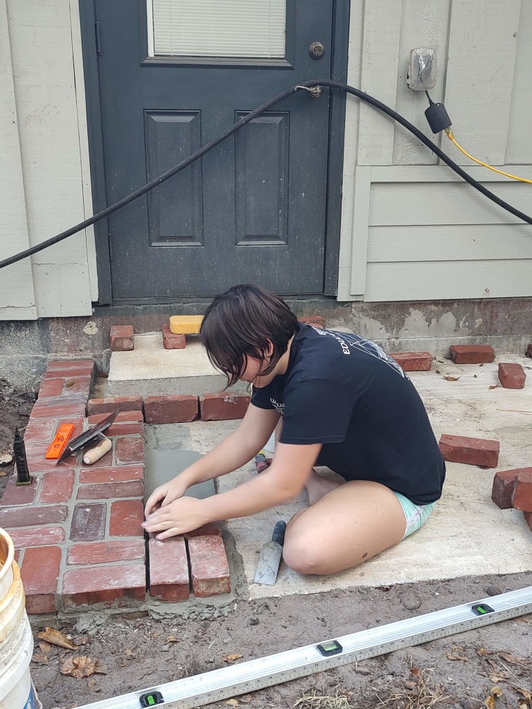 Laying bricks for patio